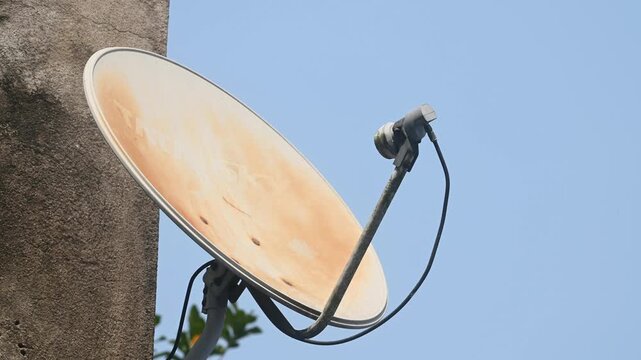 A DTH (Direct-to-Home) connection dish antenna is installed on a roof wall facing south of a house situated in a forest. United States has listed India&rsquo;s preference for the use of domestic satellites 