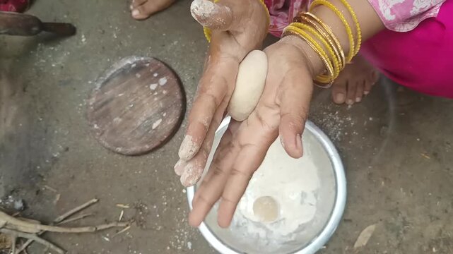 Indian Woman Making Dough Ball Loiya For Roti In Village Kitchen