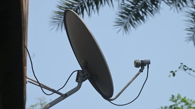 A DTH (Direct-to-Home) connection dish antenna is installed on a roof wall facing south of a house situated in a forest. United States has listed India&rsquo;s preference for the use of domestic satellites 