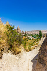Obraz premium Scenic view of Love valley in Cappadocia with volcanic rock formations. The concept represents nature, conservation, exploration, tranquility, ecotourism, destination, heritage, sustainable travel