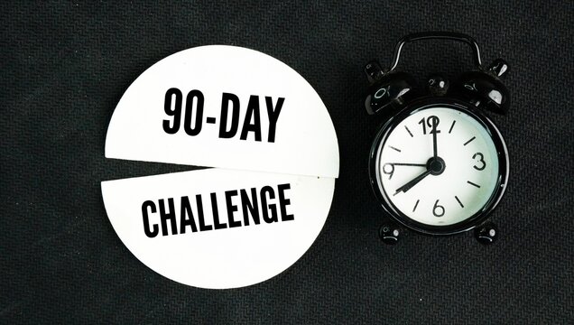 Alarm clock with the words 90 day challenge. structured personal development or lifestyle program where you commit to specific, measurable goals over a 12-week period