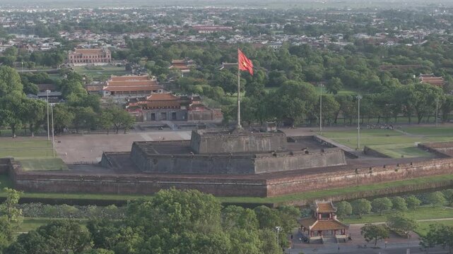 Aerial drone view of Hue Imperial Citadel featuring Ngo Mon Gate and Hue Flag Tower, showcasing Vietnam's UNESCO World Heritage site with majestic royal architecture and historic fortress.