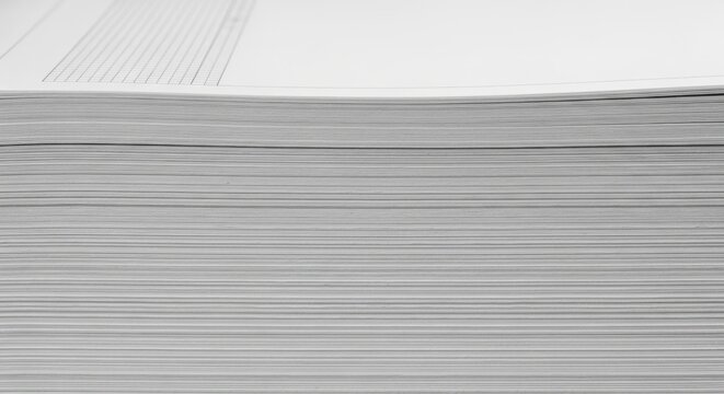 Abundant Paper Stack Crisp Sheets Ready for Printing Writing or Crafting Symbolizing Knowledge Organization and Unwritten Potential for Creative Projects and Business Documentation.