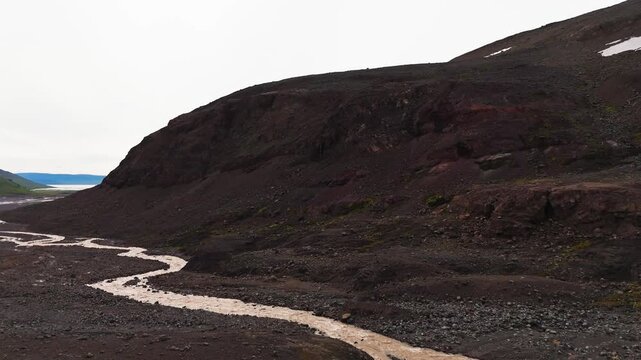 Drone Panning Landscape of Drangajokull Glacier Valley and Winding River Iceland