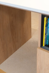 Minimal Wooden Desk Corner With Bookshelf and Stone Floor in Modern Neutral Interior Workspace  © Manual Mood