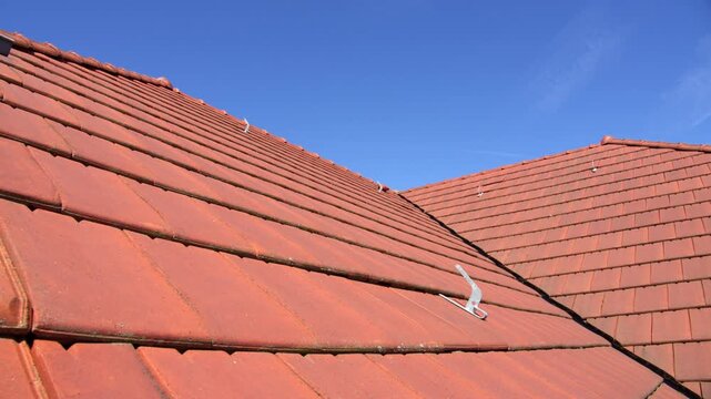 Red Interlocking Clay Roof Tiles. - closeup shot