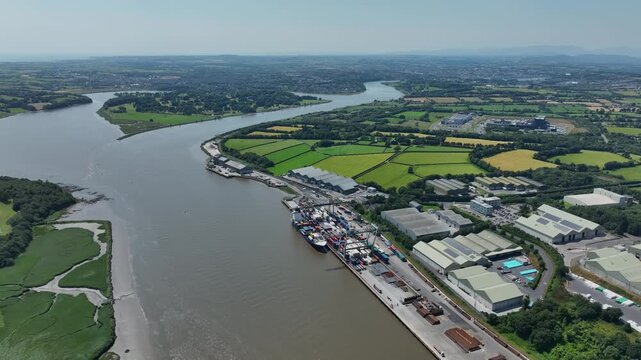 View upriver of Waterford Port with Waterford City in Background unloading and loading facility for container ships and dock for ocean liners Ireland Epic Locations in summer