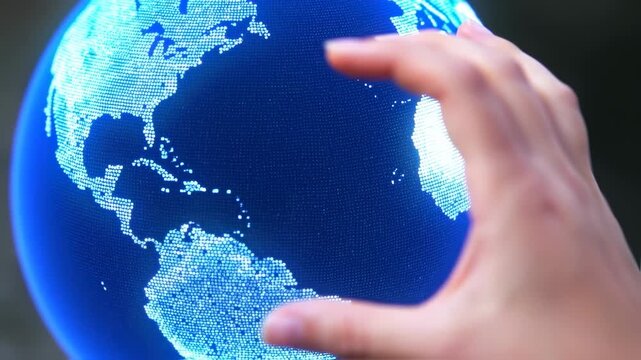A digital globe glows with dots under a reaching hand, highlighting continents in white