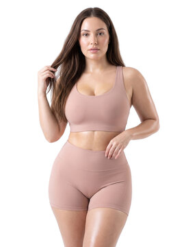 Empowered and Confident Woman Posing in Activewear, Showcasing Body Positivity and Wellness, Isolated on a Transparent Background PNG for Diverse Marketing