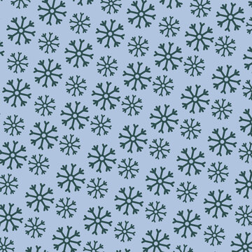 Seamless pattern with dark snowflakes on light blue background for winter and Christmas design