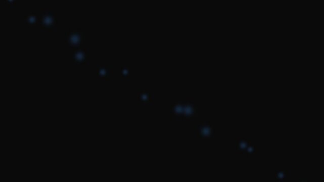 A series of glowing blue dots arranged in a diagonal line on black background