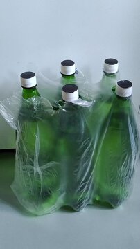 Pack of bottled drinking water on floor, emergency water supply, household water reserve and preparedness concept.