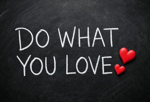 Handwritten chalkboard message do what you love with hearts for motivation and inspiration theme