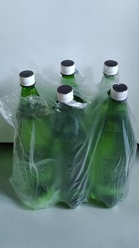 Pack of bottled drinking water on floor, emergency water supply, household water reserve and preparedness concept.