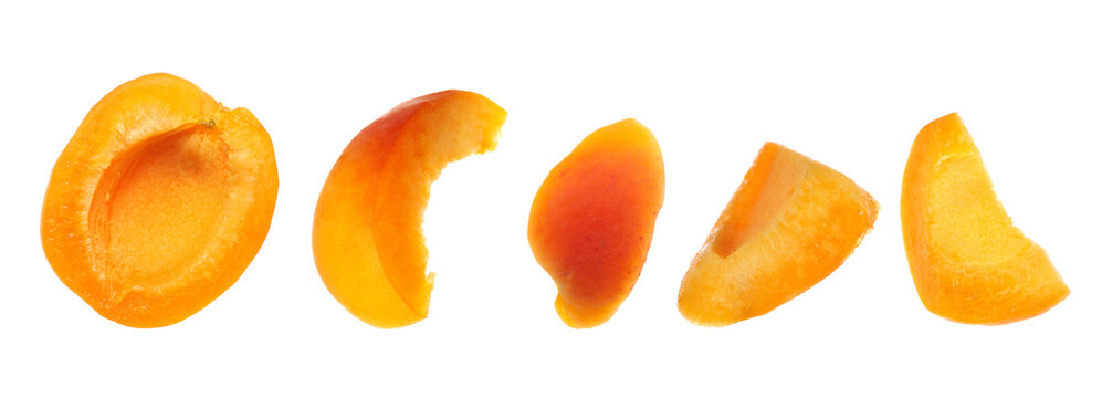 Set apricot fruit pieces flying isolated on white background, clipping path