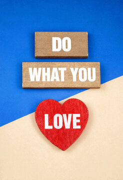 Wooden blocks with do what you love motivational message and red heart shape