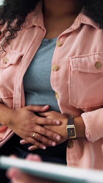 Doctor, patient and hands with discussion for stomach ache, help and tablet for endometriosis survey. Healthcare worker, person and abdomen pain in clinic with tech, advice and ovarian cyst symptoms.
