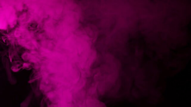 Vibrant pink smoke swirling and dissipating against a dark background