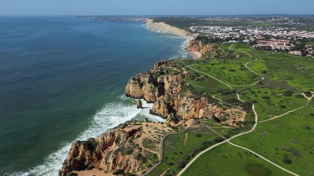Drone Aerial View of Ponta da Piedade Coastline in Lagos, Algarve, Portugal on a Summer Day