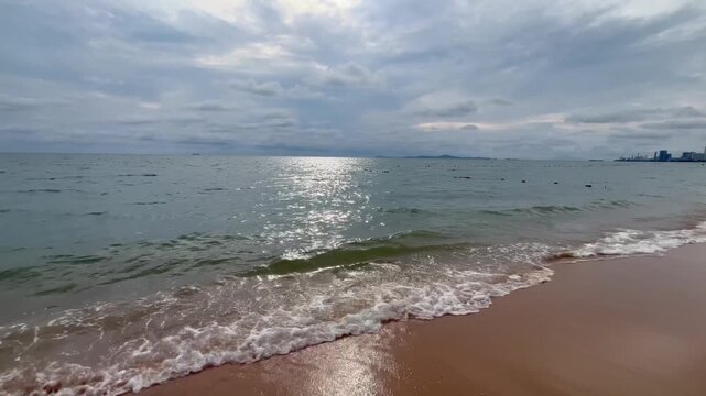 Tranquil beach surface sunlight