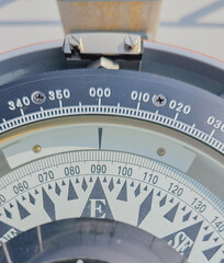 Close up view of marine ship compass repeater dial with degree scale for nautical navigation course heading control and maritime transport guidance concept © moryachka