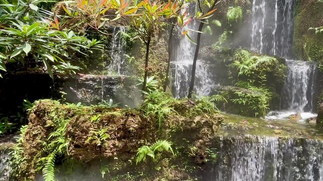 Waterfall over rocks in a garden