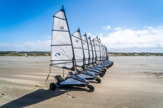 The blowcarts are standing ready with their noses into the strong wind on the beach at IJmuiden, the Netherlands.