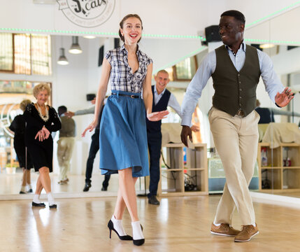 Pair dancing lindy hop during rehearsal
