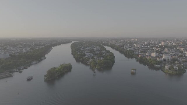 Sunset over Con Hen Islet in the Perfume River, Vy Da Ward, Hue City, Vietnam, showcasing the tranquil river landscape and the scenic beauty of Hue at dusk.