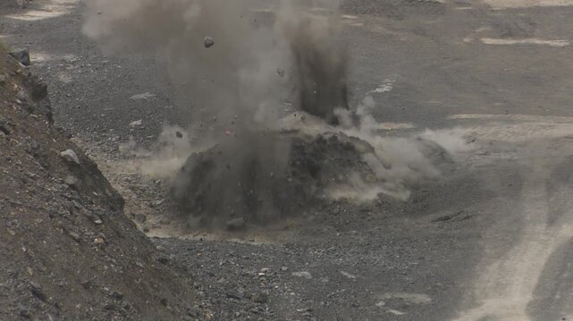 Industrial open pit mining blast operation an scene showing a controlled