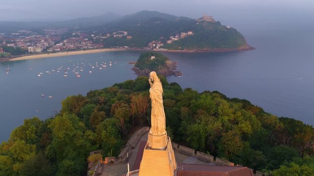 Aerial view of San Sebasti&aacute;n, coastal town in Basque Country, Spain, Christ Statue, beach of la Concha and San Sebasti&aacute;n old town drone shot, vacation in Basque Country
