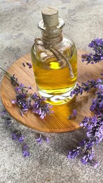 Essential lavender oil and fresh flowers rotating