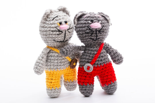 A crocheted cat toy on a white background