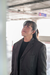 Vertical Close-Up Profile Portrait of Asian Person Gazing Upward © Ranta Images
