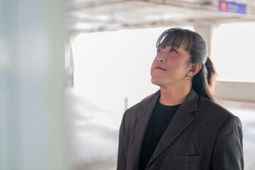 Horizontal Close-Up Profile Portrait of Asian Person Looking Upward © Ranta Images