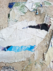 Torn and ripped urban paper poster background, messy paper old urban texture background © DaliCeMedia