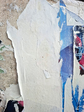 Torn and ripped urban paper poster background, messy paper old urban texture background