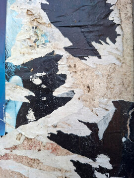 Torn and ripped urban paper poster background, messy paper old urban texture background