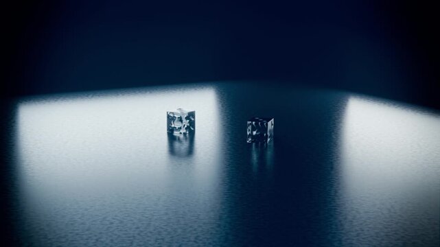 Gravity pulling two glass cubes falling and rotating onto textured table, forming light reflections
