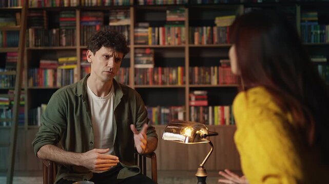 Annoyed red-haired woman arguing with boyfriend during coffee shop date
