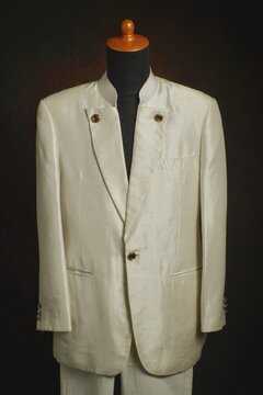 Men formal attire, suit or blazer with white trousers on display mannequin