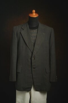 Men formal attire, suit or blazer with white trousers on display mannequin