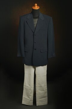 Men formal attire, suit or blazer with white trousers on display mannequin