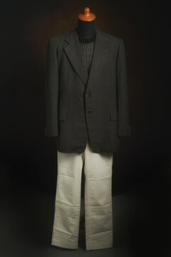 Men formal attire, suit or blazer with white trousers on display mannequin