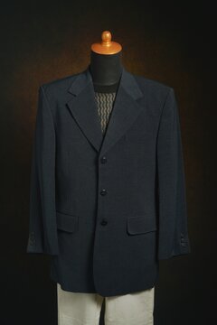 Men formal attire, suit or blazer with white trousers on display mannequin