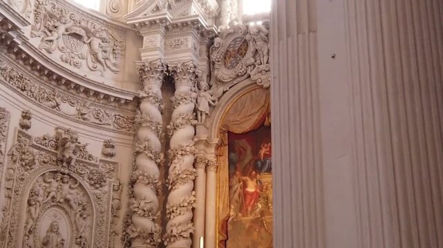 The magnificent interior architecture of a Baroque-style church or cathedral, rich in intricate carvings. 