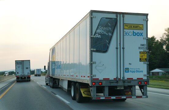 Pennsylvania, U.S.A - Jul 19, 2026 - J.B. Hunt trailer displaying 360 Box AppStore and wide-turn warnings while traveling on the highway