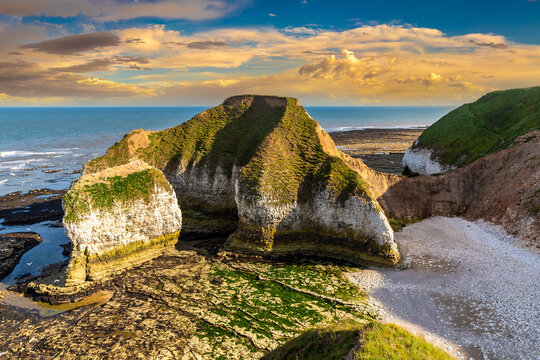 The Drinking Dinosaur chalk sea arch with white cliffs at sunset at Flamborough, England, UK