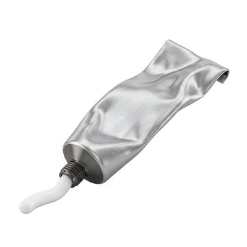 Squeezed silver toothpaste tube with white paste trail on clean white background