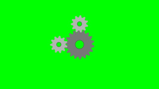 Three interlocking gears rotating on a green screen background, representing teamwork and mechanical processes.